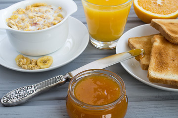 Breakfast on the grey wooden background