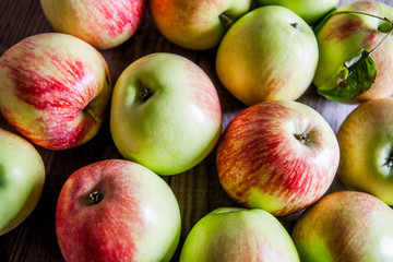 Ripe red apples on wooden background