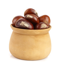 chestnut in a wooden bowl isolated on white background. Top view
