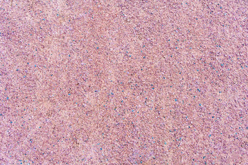 Fototapeta premium Texture of a gravel path of pink color (background)