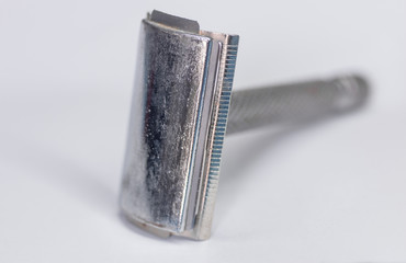 Safety metal razor isolated on white background