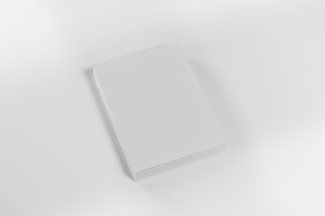 Mockup of magazine, poster, A4 brochure, catalog or flyer isolated on white background. Blank page top view for use in design, mockups and simulations.