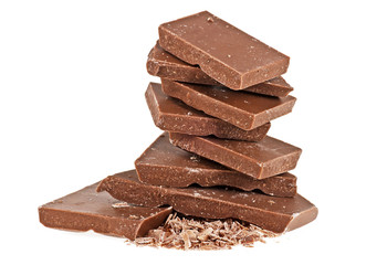 Pieces of milk chocolate on a white background