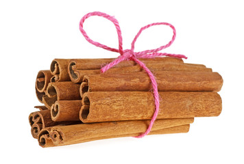 Cinnamon sticks tied by rope isolated on white background