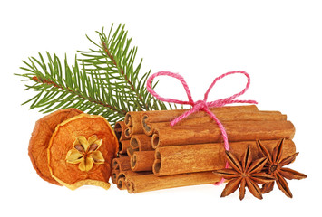 Fir tree branch, dried apple, anise and cinnamon sticks on white background