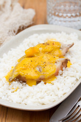 boiled fish with sauce and boiled rice on white dish