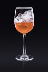 Delicious pomegranate cocktail isolated on black background