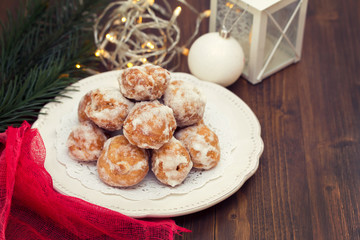 portuguese sweets on white plate on wooden background