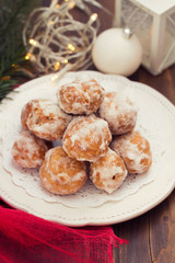 portuguese sweets on white plate on wooden background