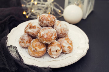 portuguese sweets on white plate on wooden background