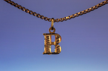 Golden B Letter chain necklace closeup macro