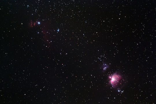The Orion Region with the Orion Nebula, the Open Cluster NGC 1977, the Flame Nebula, the Emission Nebula IC 434, and the Horsehead Nebula as seen from Battenberg in the Palatinate Forest in Germany.