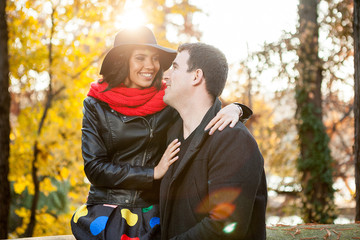 Fototapeta premium Beautiful happy couple in autumn park relaxing