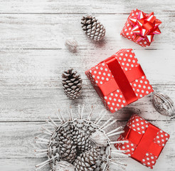 Christmas ambiance on the kitchen table, decorative fir gifts and cones, the winter holiday atmosphere