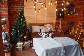 Christmas background. Loft interior room decorated in xmas style. No people. New year tree and gifts