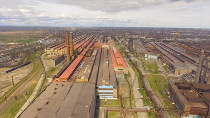 Obraz premium Aerial view of industrial steel plant. Aerial sleel factory. Flying over smoke steel plant pipes. Environmental pollution. Smoke.