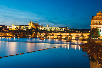 View of  Charles Bridge and Vltava river at night in Prague, Czech Republic
