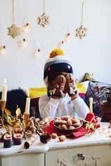 Christmas food preparation. Child in the Christmas decoration
