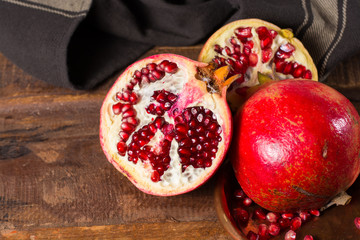 Healthy fruit red ripe pomegranate, rich of Vitamin C, also known as a symbol of prosperity, fertility and used in traditional medicine