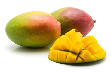 Sliced mango hedgehog shape isolated on white background one half and two whole.