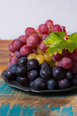 Large organic table grape Globe in assortment served on the tin plate