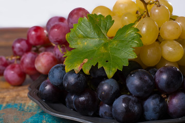 Large organic table grape Globe in assortment served on the tin plate