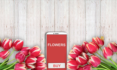 background of buying and selling flowers, red tulips on the table and the phone. - 181538839