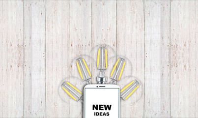 new ideas. telephone on the table and light bulbs. background for ideas - 181539234