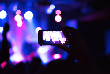 Video recording of the concert on the smartphone phone of the Beach or club party. Ð¡onceptual...