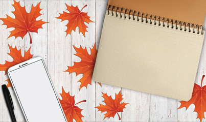 notebook, phone are lying on a wooden table with yellow, autumn leaves - 181540210