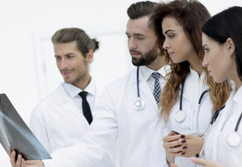 Portrait of young male doctors looking at x-ray