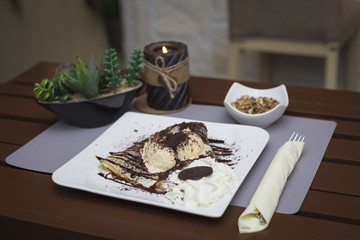 Sweet chocolate pancakes and ice cream romantic restaurant