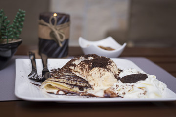 Sweet chocolate pancakes and ice cream romantic restaurant