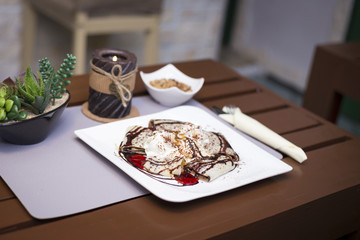 Sweet chocolate pancakes and ice cream romantic restaurant