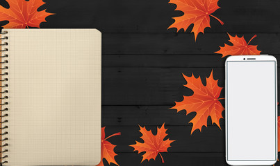 notebook, phone are lying on a wooden table with yellow, autumn leaves - 181541232