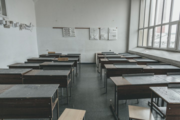 Old retro tables in the school's classroom
