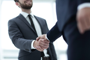 Two businessman shaking hands