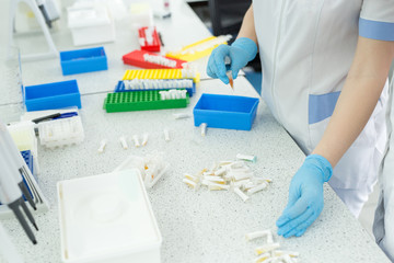 Laboratory assistant analyzing a blood sample. Medicine and science background