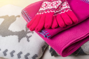 Winter time - Warm winter woolen clothes - knitted sweaters, scarves, gloves