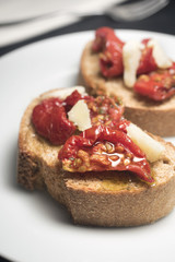 Dry tomatoes on Bruschetta with chees