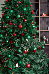 Fototapeta na wymiar new year tree with decorations, red sofa, bookshelf, present boxes