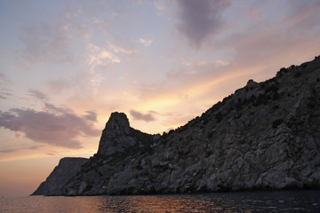 Beautiful sunset, rocky coast of Cape Fiolent. Dramatic scene. Crimea