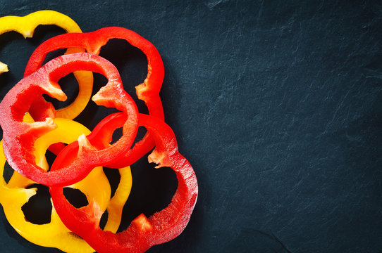 Fresh Bell Pepper Rings On A Dark Background