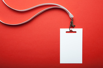 Blank name tag, with white lanyard on red. Name tag is blank for your text. Mock up.