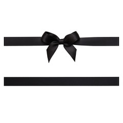 Black bow tied using silk ribbon, cut out top view - obrazy, fototapety, plakaty