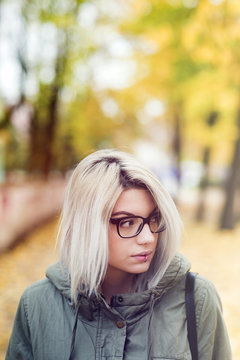 Beautiful young hipster woman with glasses