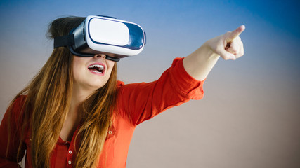 Girl wearing virtual reality goggles.