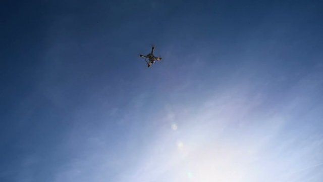 drone starting the flight and flying away in the sky