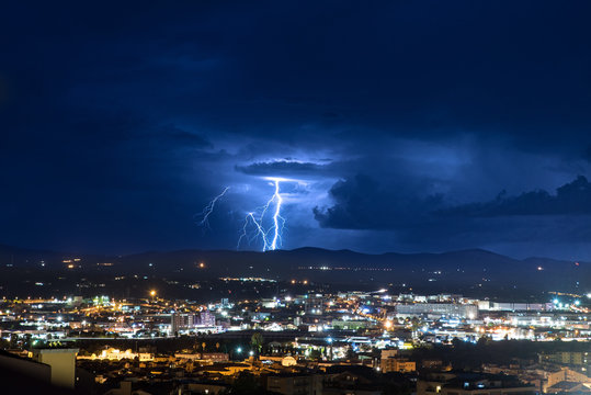 Lightning over the city at night