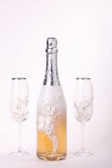 Beautiful decorated wedding glasses with bottle champagne